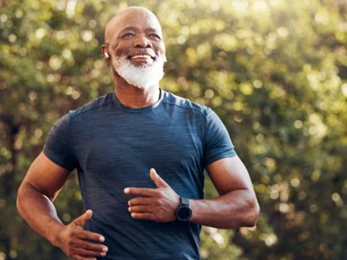 Fit mature man jogging outdoors